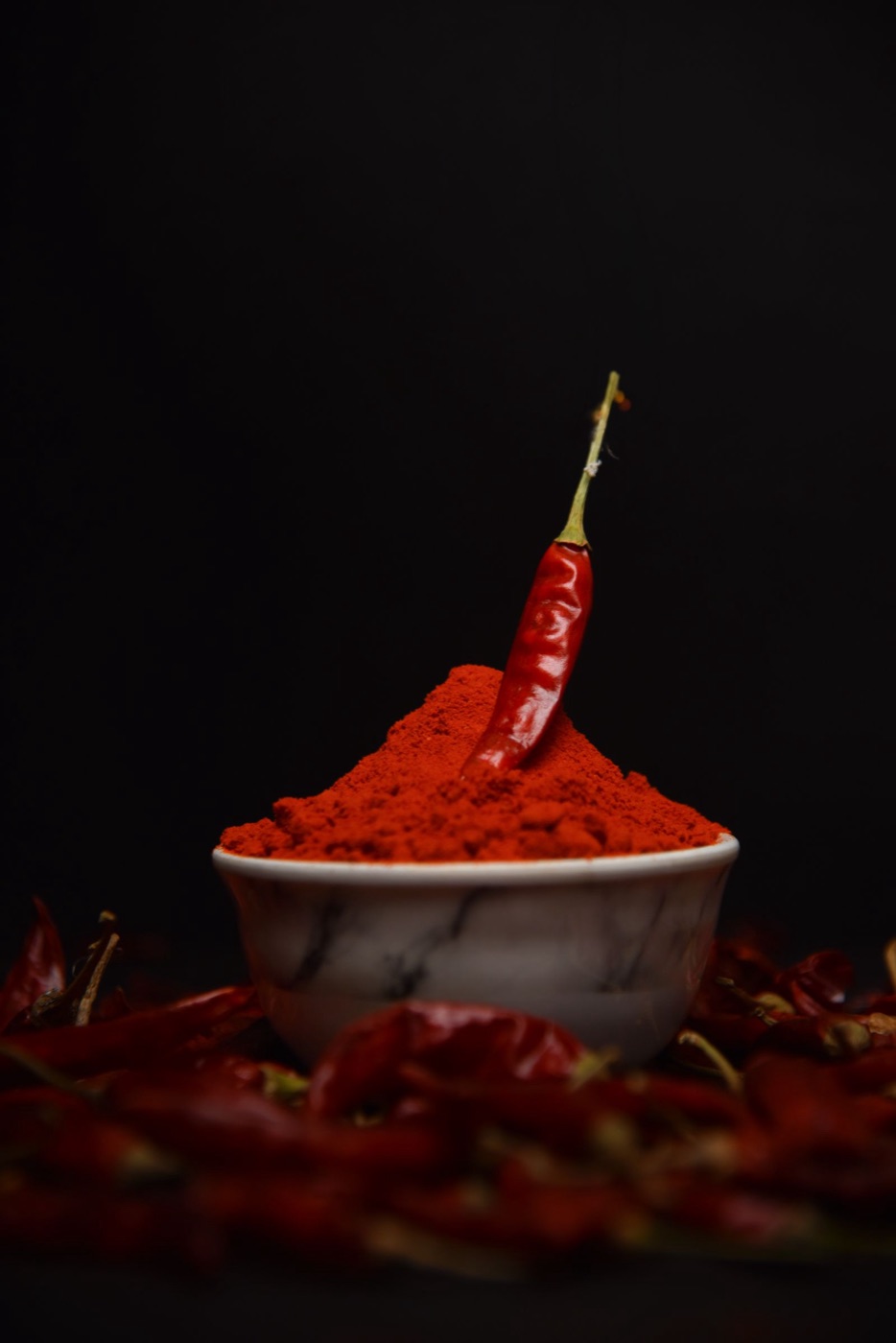 Ground red chili powder in a bowl.